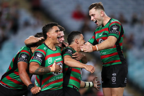 Souths celebrate their win against the Roosters in round three.
