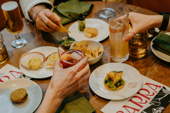 Happy hour and snacks at Barra is a great group option.