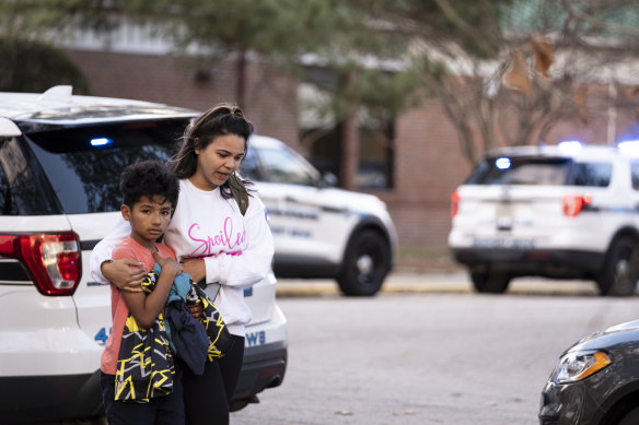 A fourth-grader leaves Richneck Elementary School with his mother after the shooting.