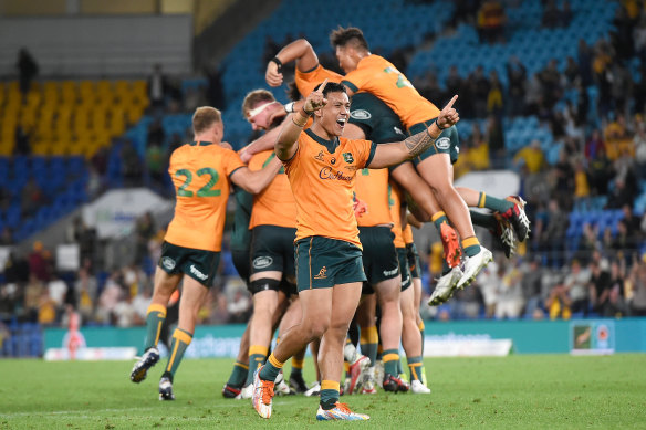 The Wallabies celebrate after Quade Cooper’s decisive penalty kick against South Africa last month.
