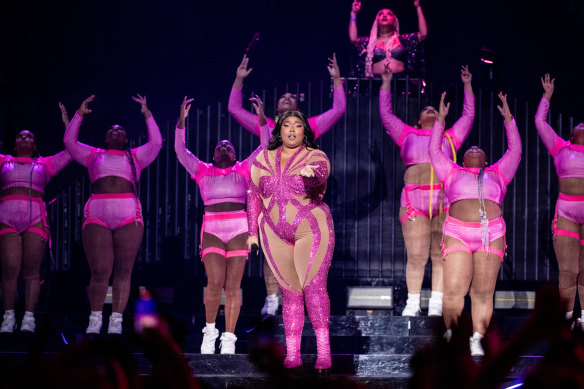 Lizzo performing with her backup dancers in California in 2022.