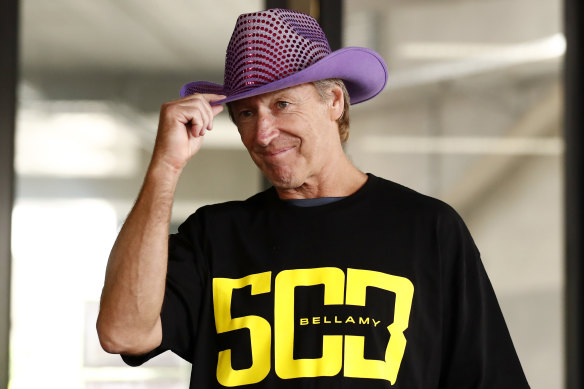 Craig Bellamy tips his new hat, courtesy of Molly Meldrum, ahead of game 500.