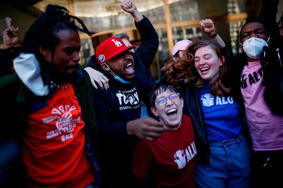 Staten Island based Amazon.com Inc distribution center union members celebrate after getting the voting results to unionise.