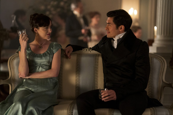 Dakota Johnson, left, and Henry Golding in a scene from Persuasion.