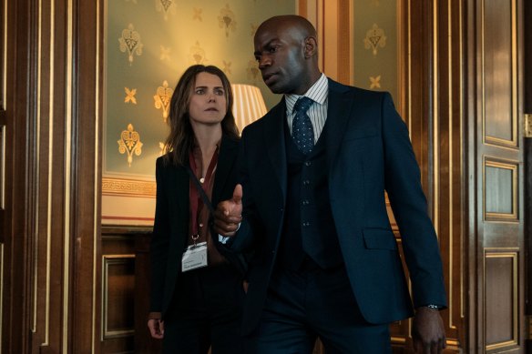 Kate Wyler (Keri Russell) and Austin Dennison (David Gyasi) walk the halls of power in The Diplomat.