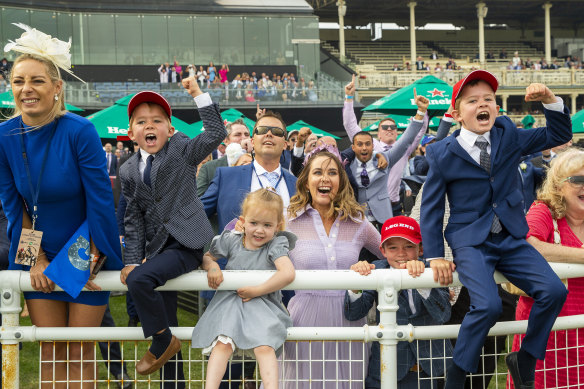 Cathy McEvoy, wife of the winning jockey, and her children cheer on Kerrin McEvoy during The Everest at Royal Randwick Racecourse in 2020.