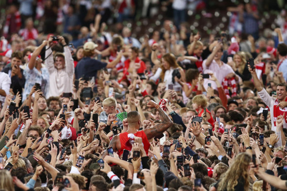 Lance Franklin is surrounded by fans after his 1000th goal.