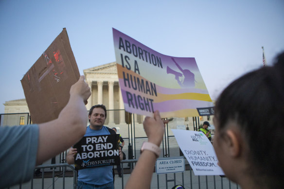 Demonstrators on both sides of the abortion issue outside the US Supreme Court after it struck down federal abortion rights protections.