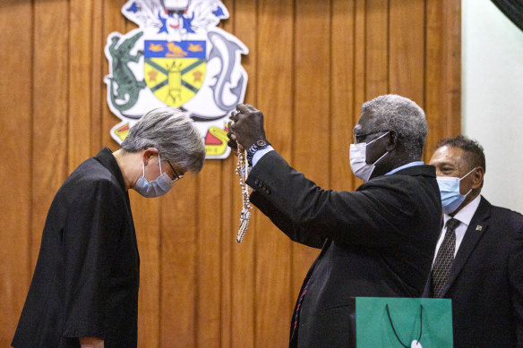 Foreign Minister Penny Wong being welcomed by Solomon Islands Prime Minister Manasseh Sogavare earlier this year.