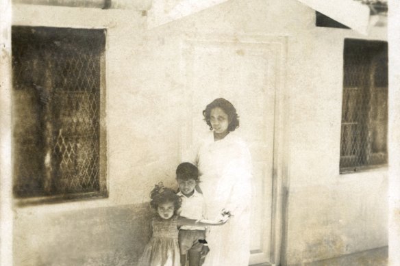 Roy with her brother, Lalith Kumar Christopher Roy, and her mother, Mary Roy, in front of their house in Ooty, India, in 1963.