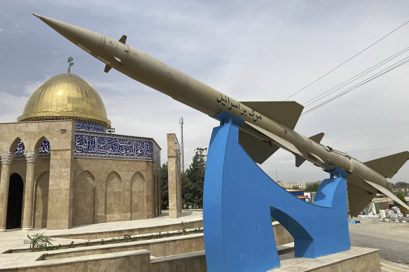 A missile is on display with a sign on it reading in Farsi: “Death to Israel” in front of a mosque in the shape of Dome of the Rock of Jerusalem at an entrance of the Quds town west of the capital Tehran, Iran.