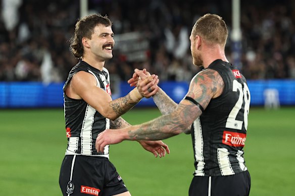 Oleg Markov with new Pies teammate Tim Membrey.