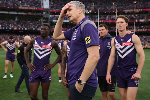 Fremantle coach Justin Longmuir and his players after the loss.