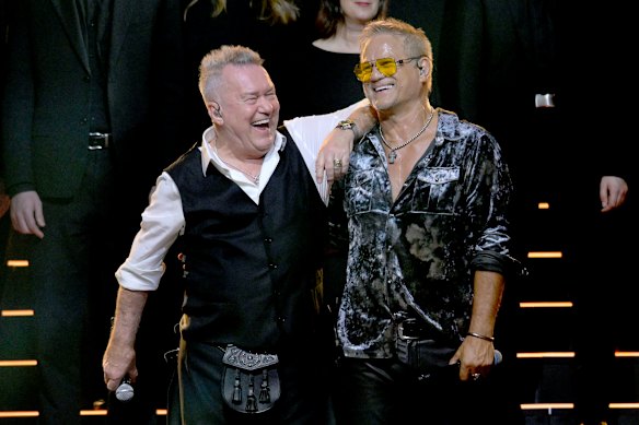 Jimmy Barnes and Jon Stevens on stage at the John Farnham Tribute Concert at Rod Laver Arena on Sunday.