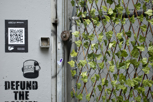 Plastic plants on the fence at Meyers Place, which was part of the Green Your Laneway project. 