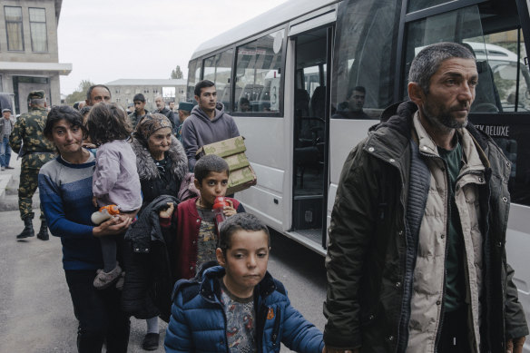 Refugees from Nagorno-Karabakh arrive in Goris, Armenia, on Sunday.