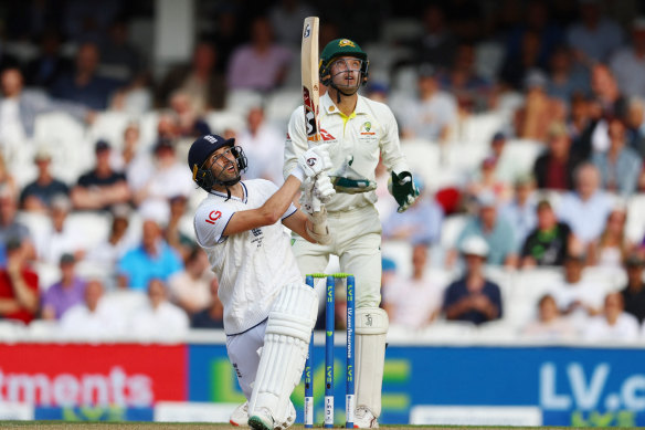 England’s Mark Wood lofts a delivery from Australia’s Todd Murphy and is caught by Mitchell Marsh. 