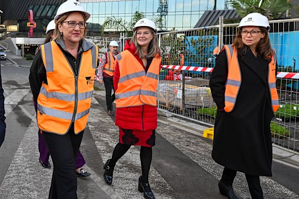Premier Jacinta Allan, Minister for Planning Sonya Kilkenny  and Treasurer Jaclyn Symes at a construction site in the Docklands on Wednesday.