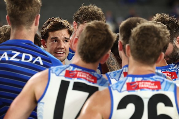 North Melbourne skipper Jy Simpkin tries to inspire his team against Collingwood.