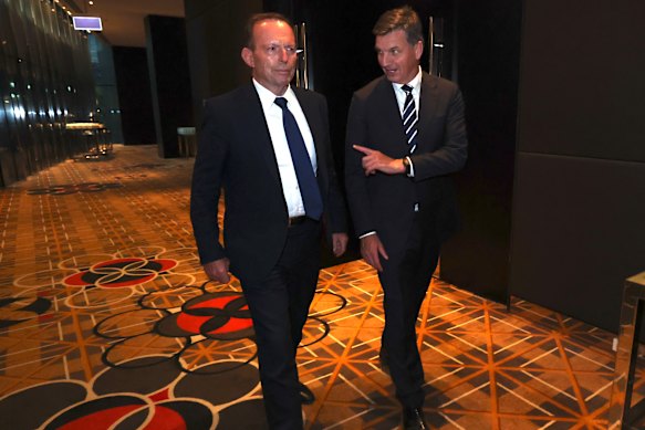 Abbott and Taylor appear at the Liberal Party's federal council on Saturday.