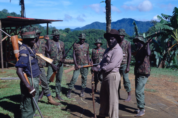 BRA leader Francis Ona with his men in his home village of Guava, above the Panguna mine, in 1994.