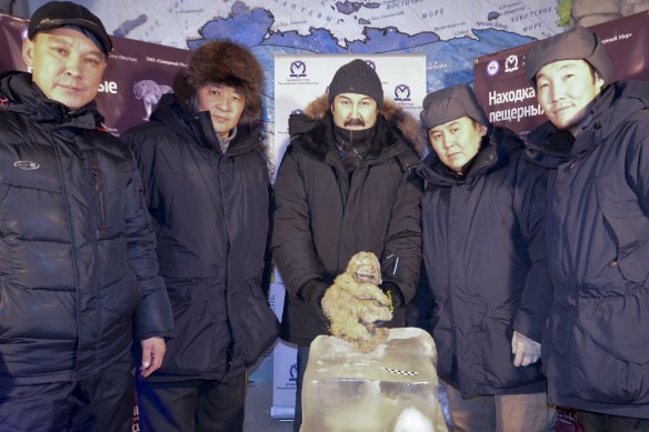 From left: Yakov Androsov, Albert Protopopov, Gennady Boyeskorov, Valery Plotnikov and Stanislav Kolesov from the Russian Academy of Sciences of the Republic of Sakha show off the body of a cave lion at the Kingdom of Permafrost museum in Yakutsk in 2015.