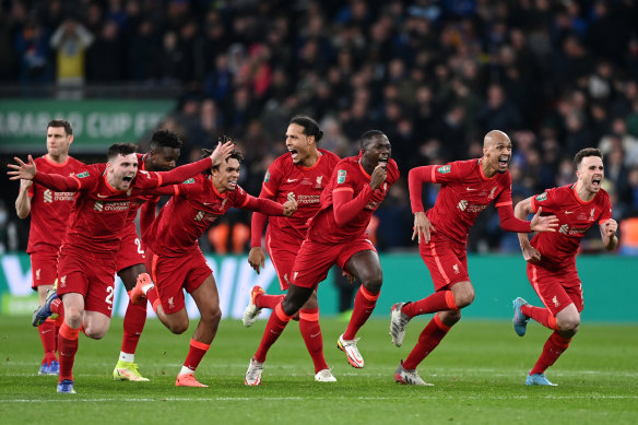 Liverpool players celebrate winning the Carabao Cup at Wembley Stadium.