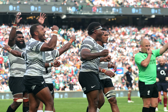 Fiji celebrate their historic victory at the final whistle.