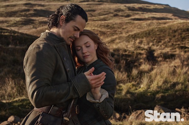 Outlander: Blood Of My Blood season 2 promotional image. Jamie Roy as Brian Fraser. Harriet Slater as Ellen MacKenzie.