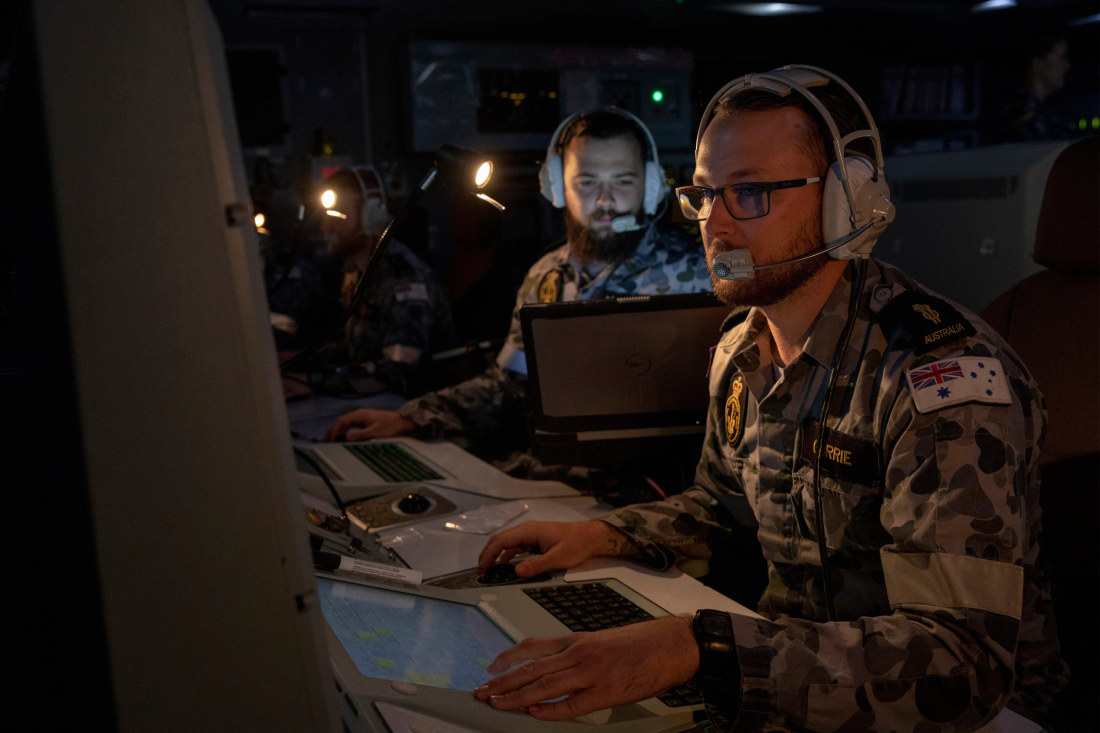 Australian navy’s combat system operators aboard an ANZAC-class frigate  monitor cyber activities.