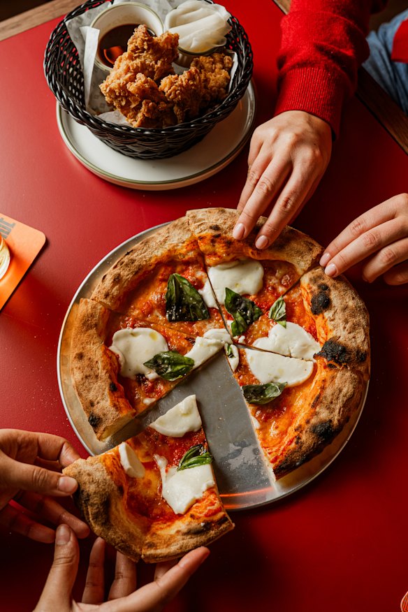 Pizzas are on the pub menu downstairs.