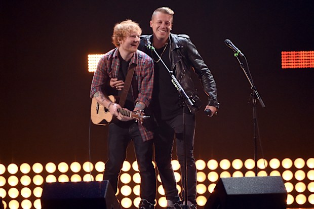 Singer/songwriter Ed Sheeran (L) and rapper Macklemore perform onstage during the 2014 iHeartRadio Music Festival at the MGM Grand Garden Arena on September 20, 2014 in Las Vegas, Nevada