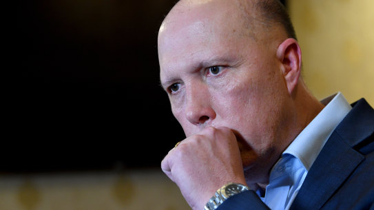 Home Affairs Minister Peter Dutton's positive test result for coronavirus sparked a dispute about the formal medical advice.