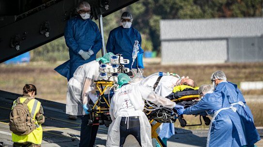 A COVID-19 patient at Avignon  is evacuated on a French Air Force plane to Brest. As hospitals near capacity in France, patients requiring urgent treatment are being transferred across the country.