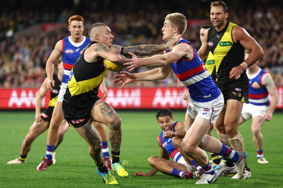 Dogs in control as young Tiger leaves field on a stretcher; Suns on top of Roos; Bombers climb into top four