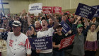 Donald Trump supporters listen to him speak at a rally in Waterloo, Iowa.