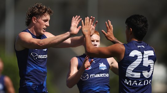 North Melbourne spearhead Nick Larkey acknowledges his teammates after slotting one of his five goals in the match simulation against Collingwood.