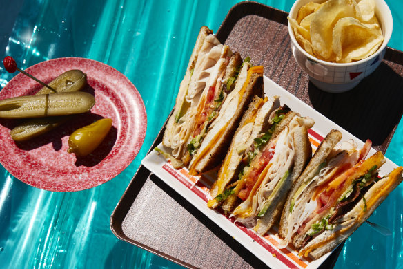 Garlic-buttered bread sends the flavour of this club sandwich soaring.