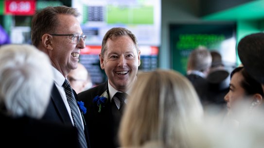 Tabcorp chairman Bruce Akhurst and CEO Adam Rytenskild survey the betting giant’s marquee.