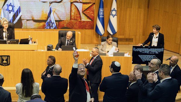 Israeli Minister of National Security, Itamar Ben-Gvir (centre), and members of parliament celebrate after passing the law approving the death penalty for Palestinians convicted of murdering Israelis.