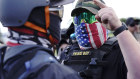 A right-wing demonstrator gestures toward a counter-protester as members of the Proud Boys and other right-wing demonstrators rally in Portland, Oregon, on September 26.  