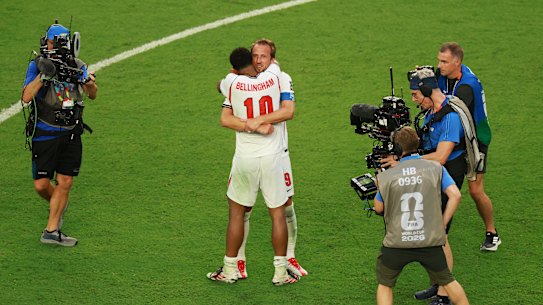 Kane and Bellingham embrace.