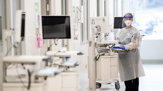 A paediatric nurse helps prepare extra beds at the Monash Medical Centre on Wednesday.