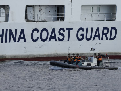 The Chinese Coast Guard and maritime militia keep watch around islands and other land features that Beijing lays claim to in the South China Sea.