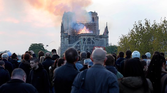 People broke out in song as flames engulfed Notre Dame Cathedral.
