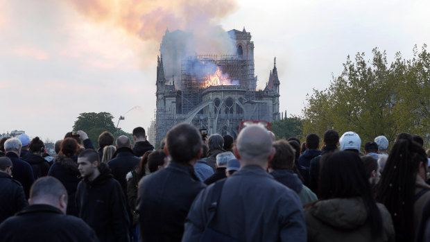 As history went up in flames, the sound of song came from Paris' streets