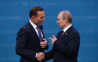 Tony Abbott welcomes Vladimir Putin to the G20 in Brisbane in 2014.