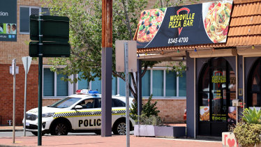 Police outside the Woodville Pizza Bar after it was announced a worker from the shop lied to authorities during a COVID-19 investigation, causing SA to go into a hard lockdown.