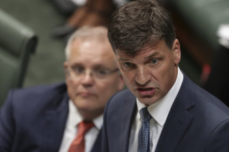 Minister for Energy and Emissions Reduction Angus Taylor speaks during Question Time in February, flanked by Prime Minister Scott Morrison.