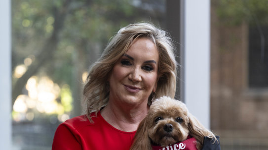 Gina Edwards and Oscar the cavoodle after she won her defamation case against Nine.